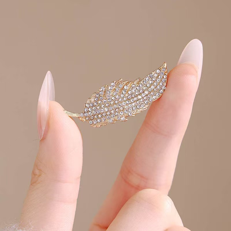 El broche de plumas de diamant - Travel Accessories Luxury reseña y precio